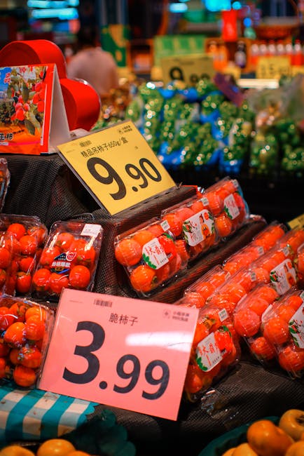 Fresh strawberries and fruit in a market with price tags