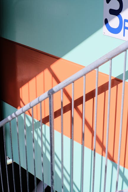 Staircase with sharp geometric shadows representing physical movement