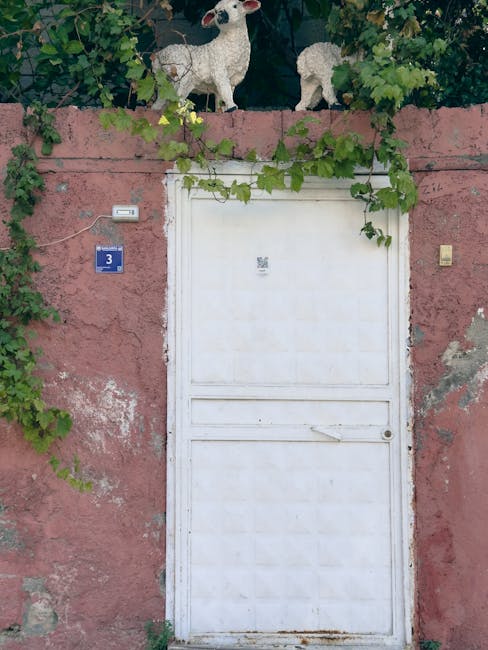 A welcoming white door with ornamental figures representing open community